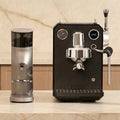 G3006 Espresso machine and G9010C coffee grinder on a marble surface with a neutral background