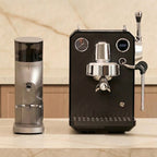 G3006 Espresso machine and G9010C coffee grinder on a marble surface with a neutral background